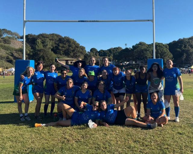 The Santa Barbara Mermaids squad in blue kit, together under the posts after a match